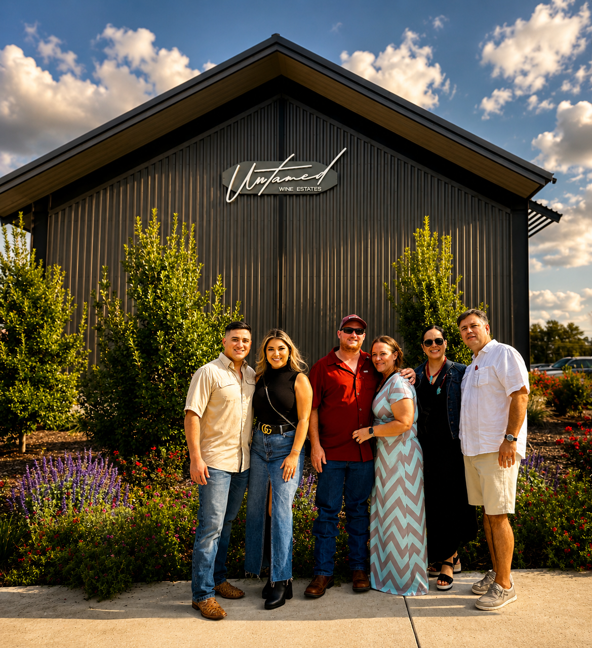 Private wine tour group smiling outside a Hill Country winery